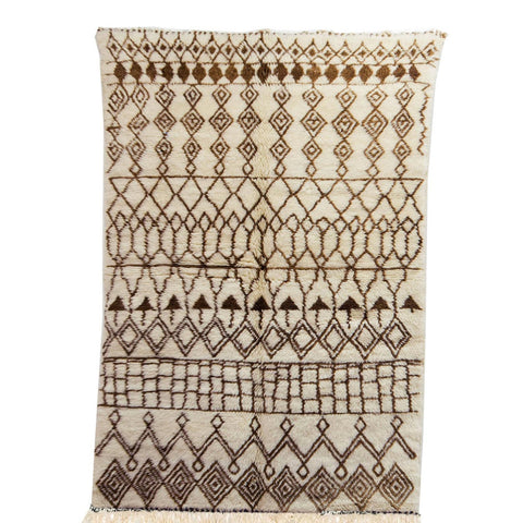 Front view of the brown striped Moroccan rug featuring tribal patterns in black and off-white.