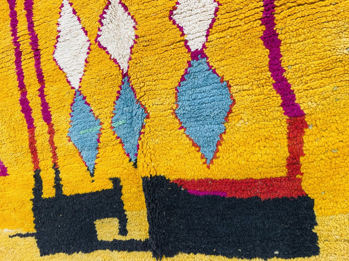 Close-up of an abstract Moroccan rug showcasing a textured surface with vibrant colors.