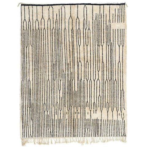 Front view of a contemporary Moroccan rug featuring a geometric pattern in black and white.