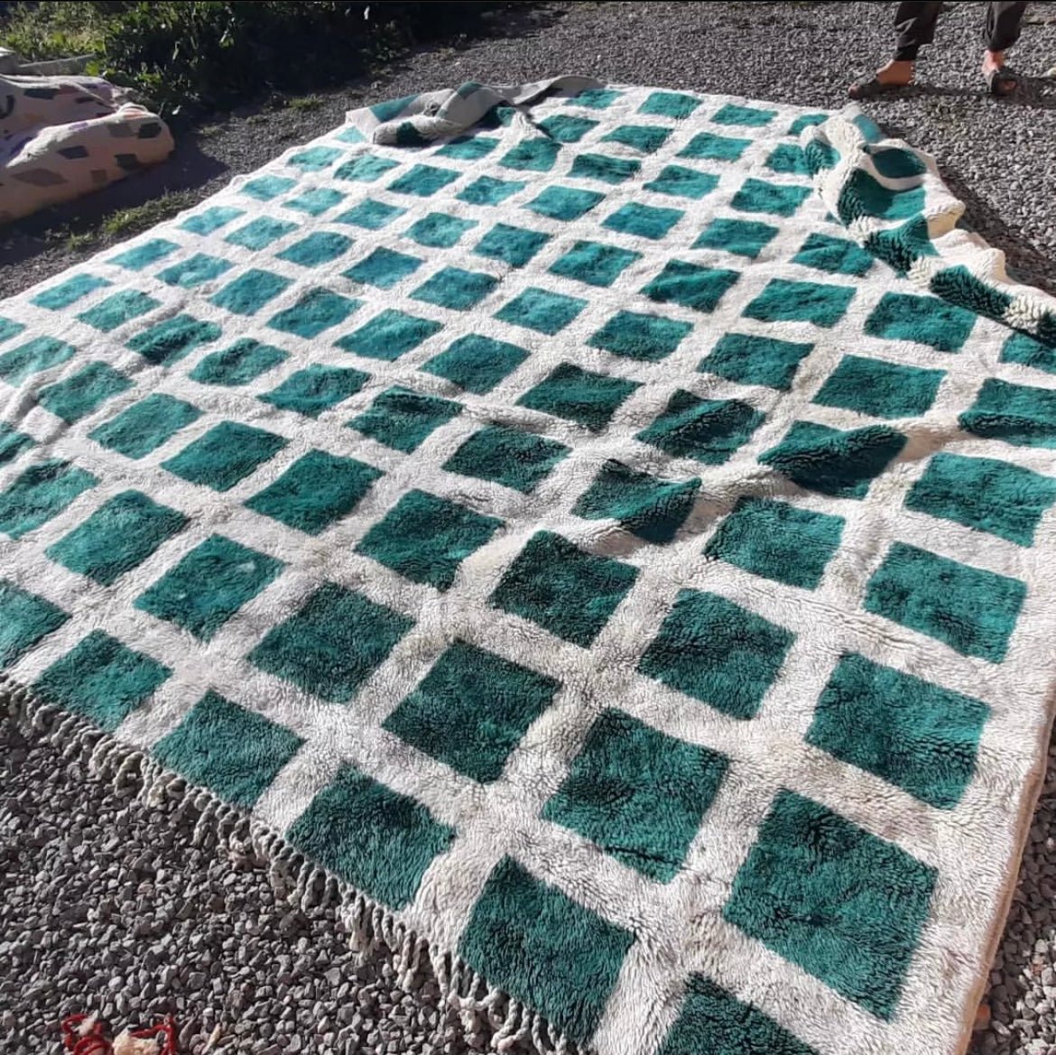 Lifestyle angle of the green and white checkered Beni Ourain rug featuring a geometric pattern.