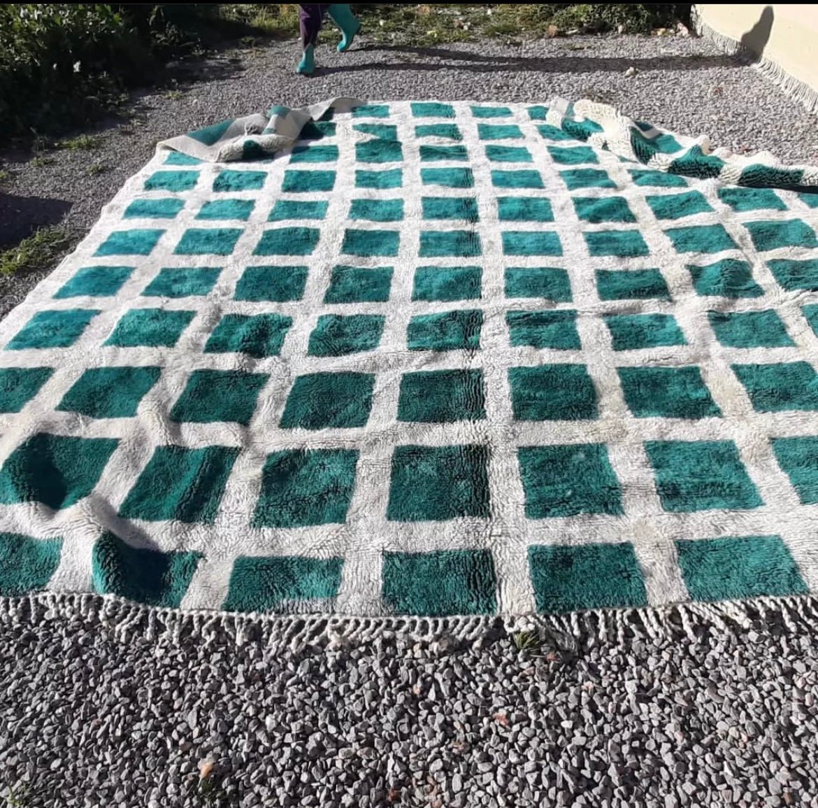 Lifestyle view of the green checkered Beni Ourain rug showcasing its geometric design.