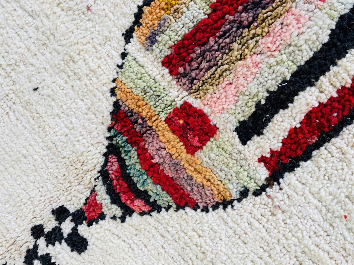 Detail view of the abstract pattern on the vintage Moroccan rug.