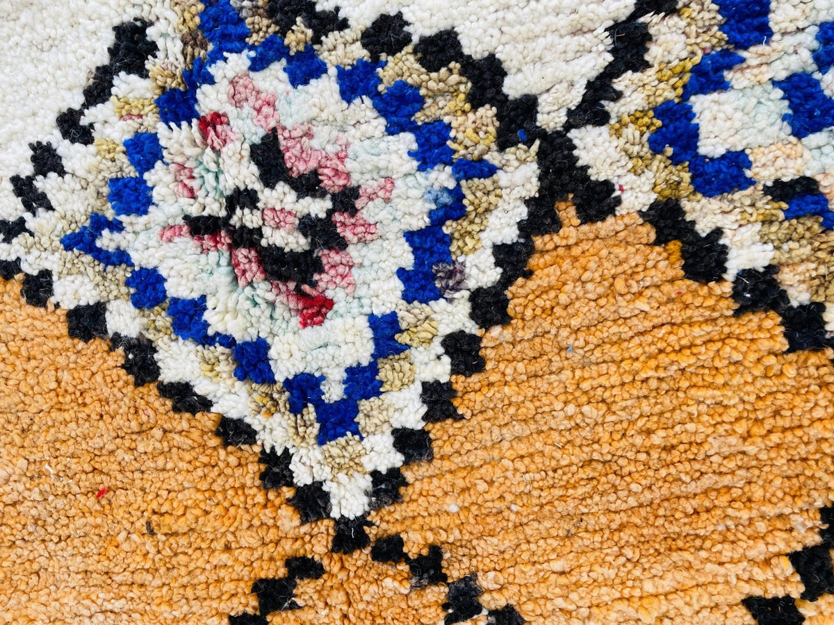 Detail shot of the diamond pattern on the vintage Moroccan rug.