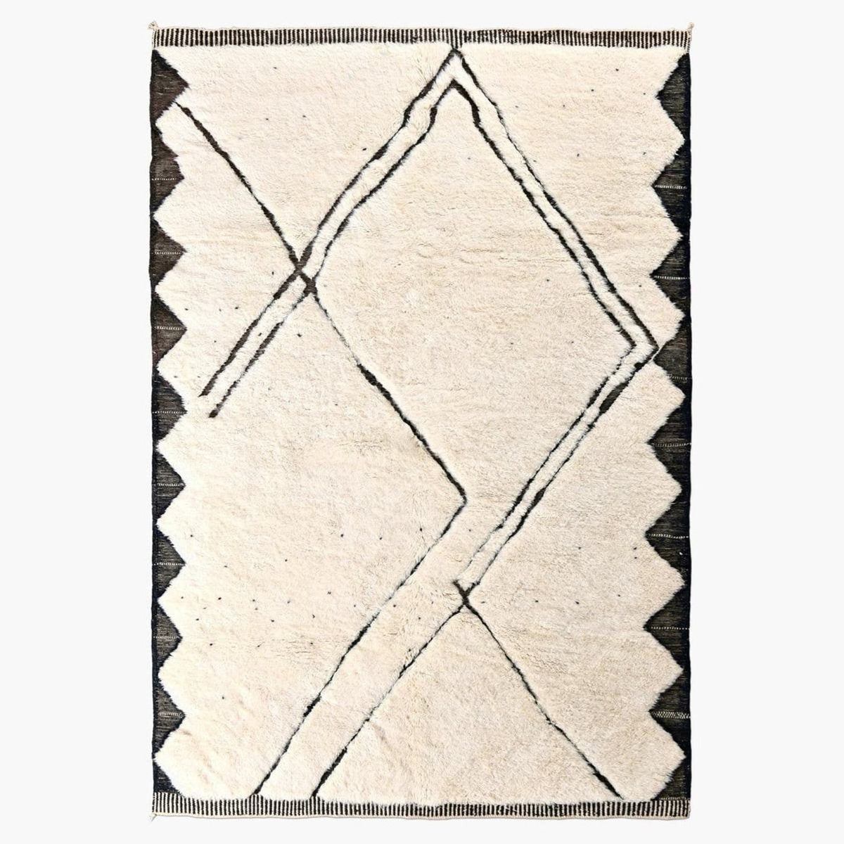 Front view of the cream and black geometric area rug with scalloped edges.