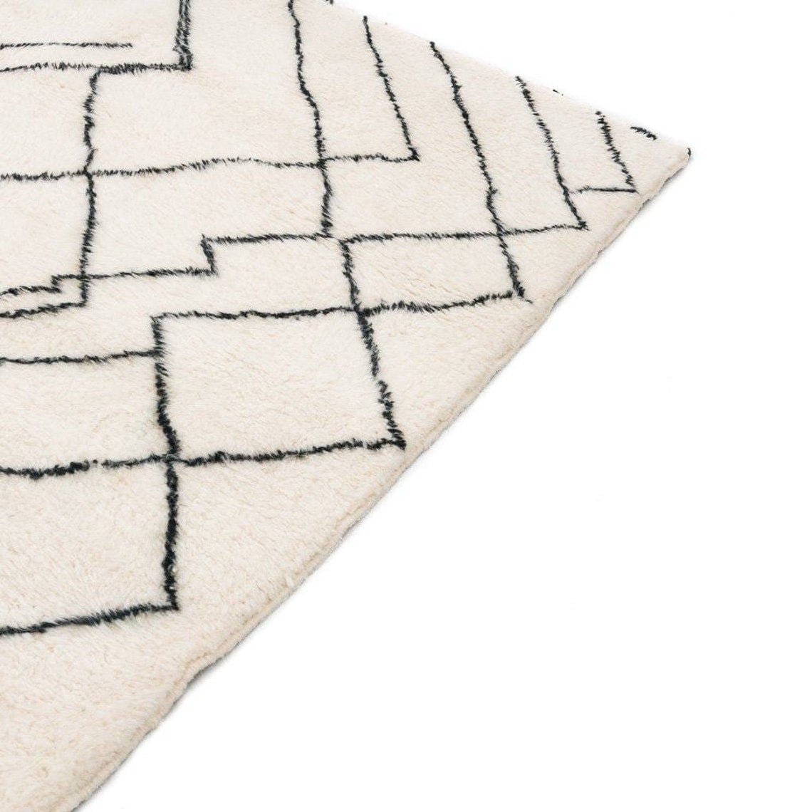 Side view of the geometric white area rug showcasing its geometric design.