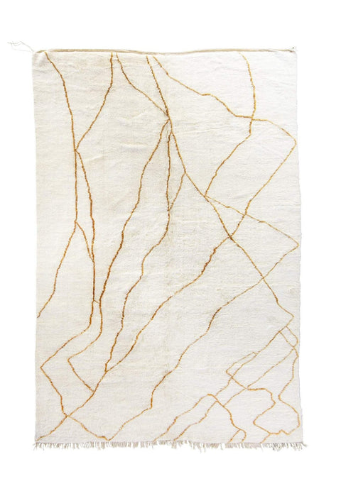 Front view of a gold abstract Beni Ourain Moroccan rug with black and off-white colors.