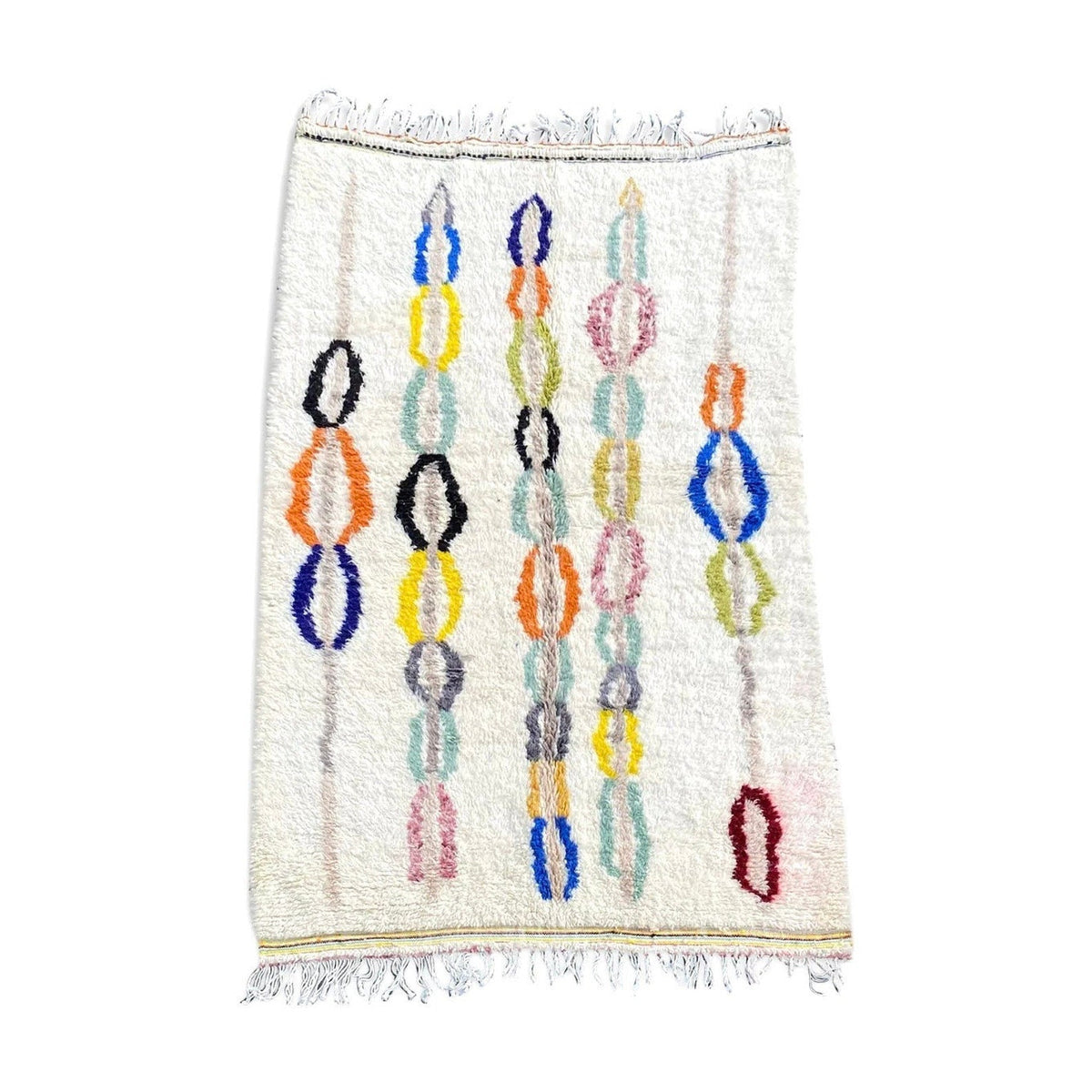 Front view of a pastel multicolor bohemian rug featuring geometric patterns and fringe edges.