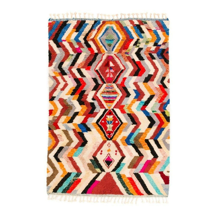 Front view of a colorful Moroccan rug featuring geometric patterns on a white background.