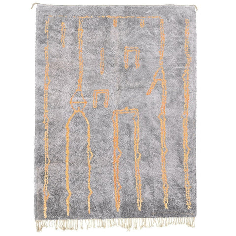Detail view of the gray Moroccan rug showcasing geometric patterns on a white background.