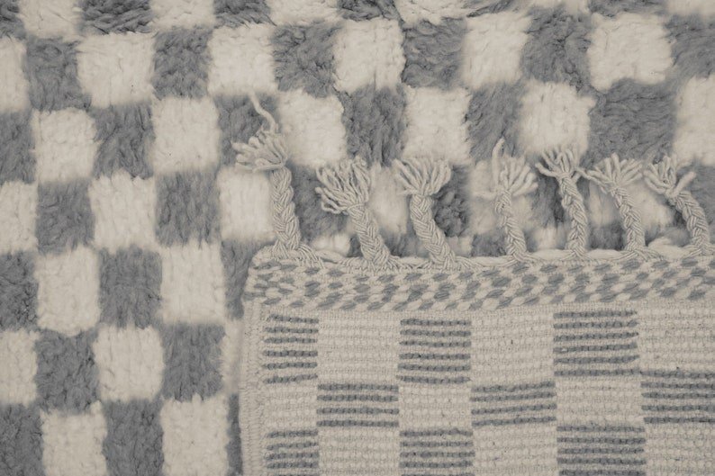 Front view of the gray checkered Moroccan rug highlighting its design on a white background.