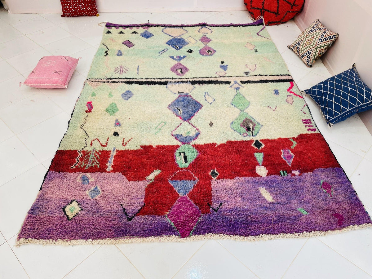 Close-up detail of the textured fibers and colorful design of the Boujaad Moroccan rug.