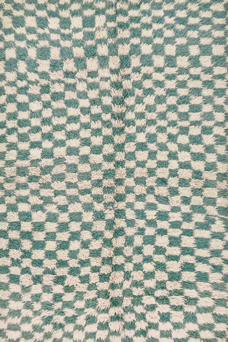 Close-up detail of the green checkered Moroccan tribal rug featuring its intricate design.