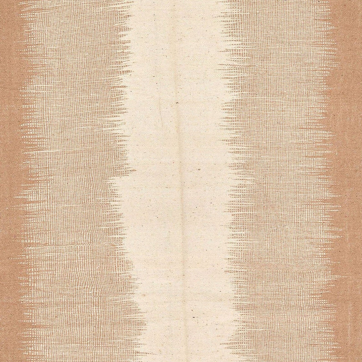 Close-up detail of the cream and tan striped Moroccan rug highlighting its flatweave pattern.