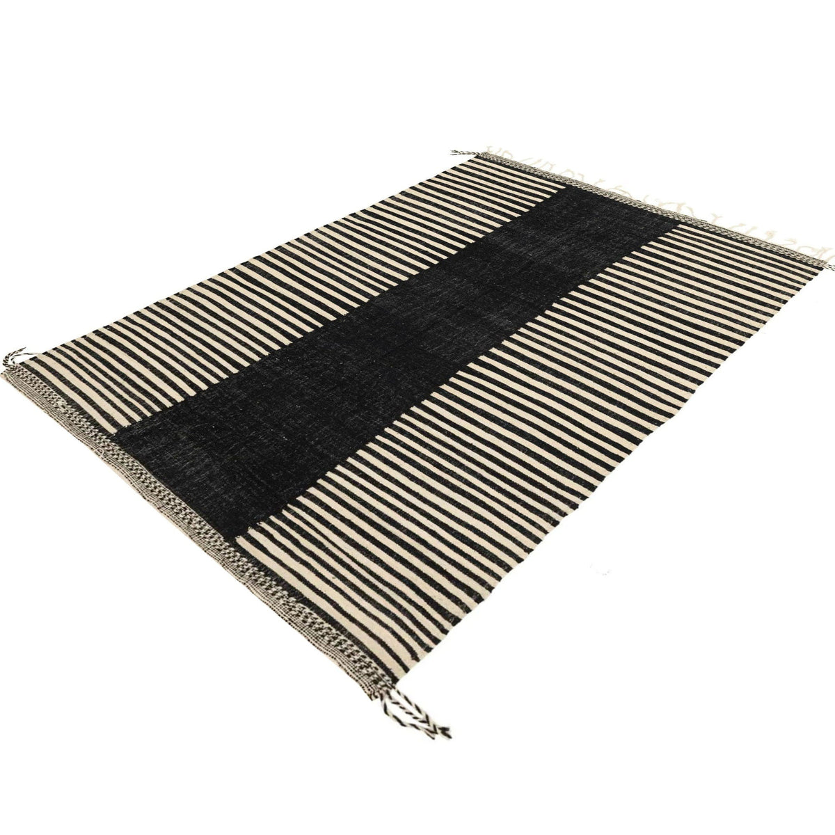 Side view of the zebra print rug emphasizing the flatweave design and color contrast.