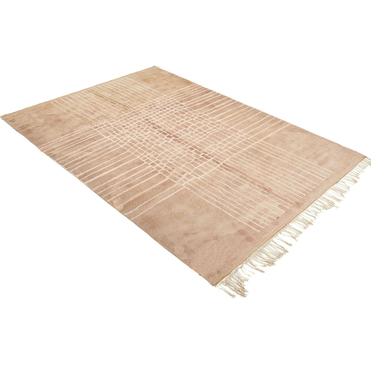 Detail close-up of a neutral Moroccan rug featuring woven texture and fringe edges.