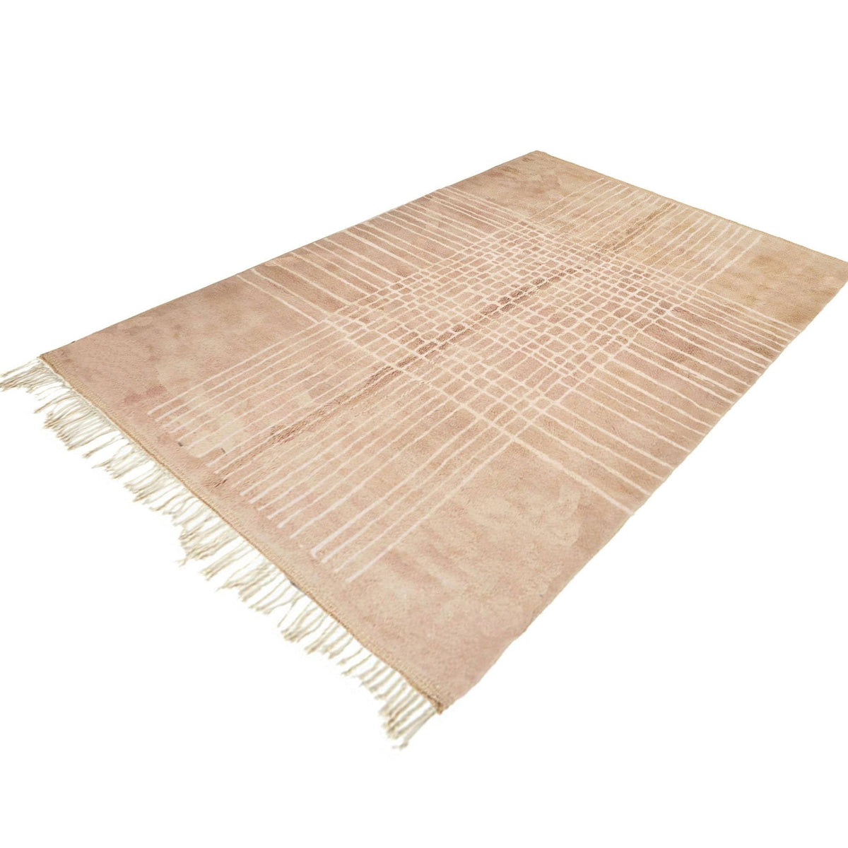 Side view of a neutral Moroccan rug displaying woven texture and fringe edges.