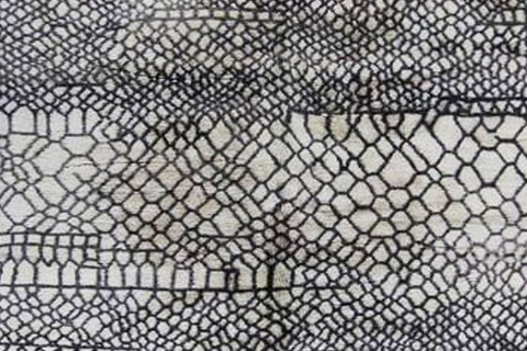 Front view highlighting the abstract design and color contrast of the Beni Ourain rug.