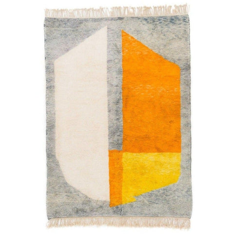 Front view of the gray and orange color block rug featuring geometric design.