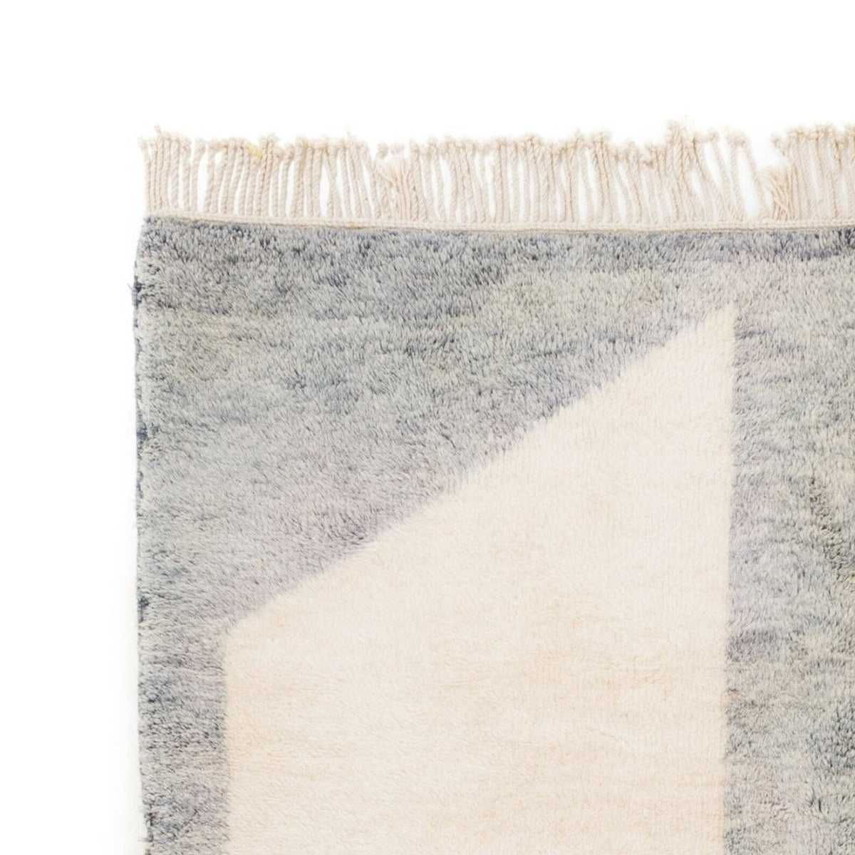 Front view of the gray and orange color block rug showcasing its geometric pattern.