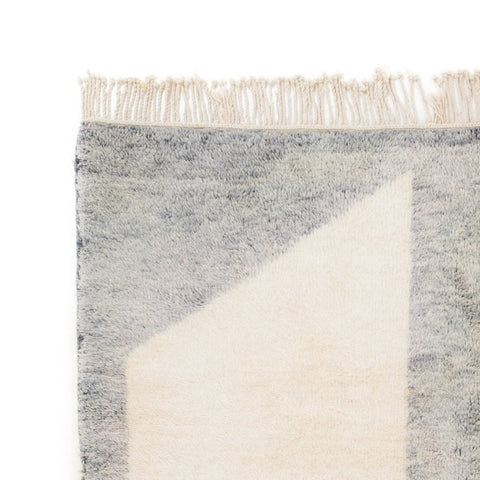 Front view of the gray and orange color block rug showcasing its geometric pattern.