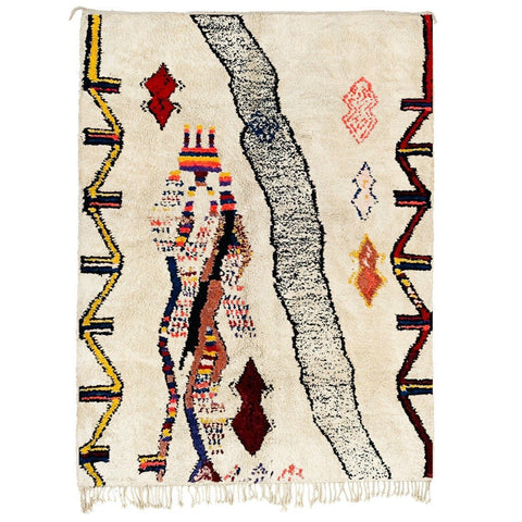 Detail close-up of the multicolor abstract Azilal Moroccan rug showcasing red, blue, and orange patterns.