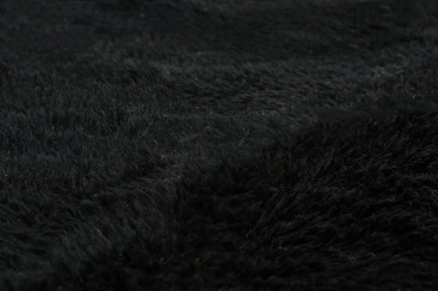 Detail view of a black and white Moroccan Beni Ourain rug highlighting its Berber design.