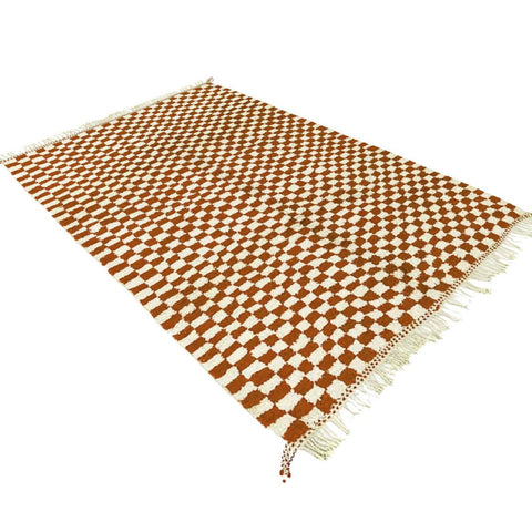 Close-up detail showcasing the beige checkered design of the Moroccan rug.