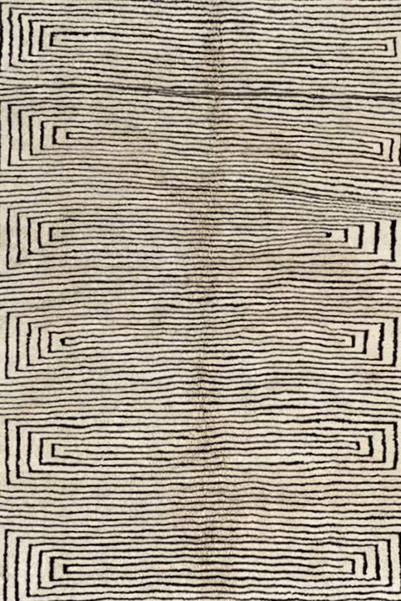 Close-up detail of the striped maze rug highlighting its texture and colors.
