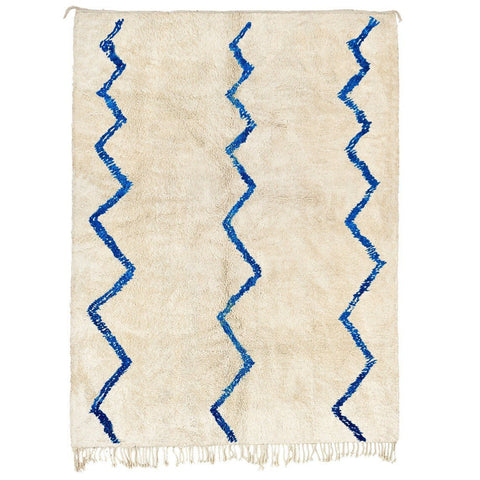 Front view of a blue striped Beni Ourain Moroccan rug featuring a zigzag pattern on a white background.