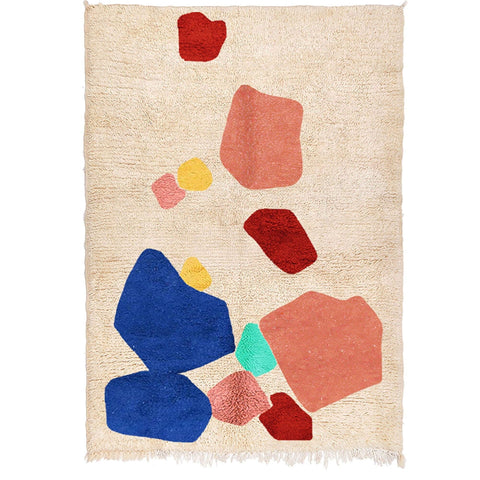 Front view of the multicolor abstract design rug featuring beige, red, blue, and green.