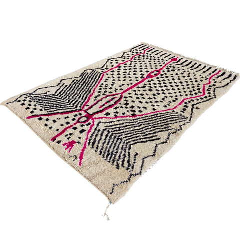 Side view highlighting the pink and black geometric patterns of the Azilal rug.