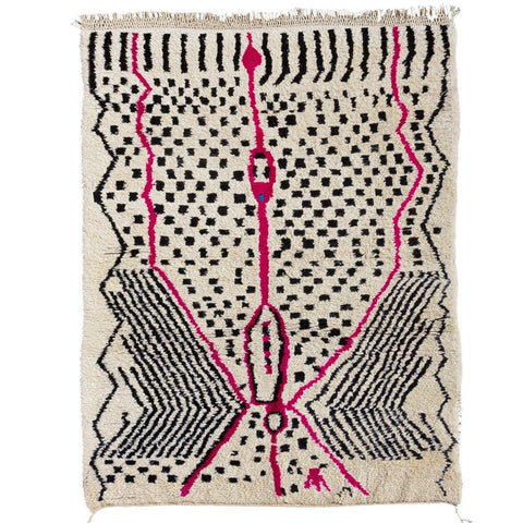 Detail close-up of the pink and black geometric pattern on the Azilal rug.