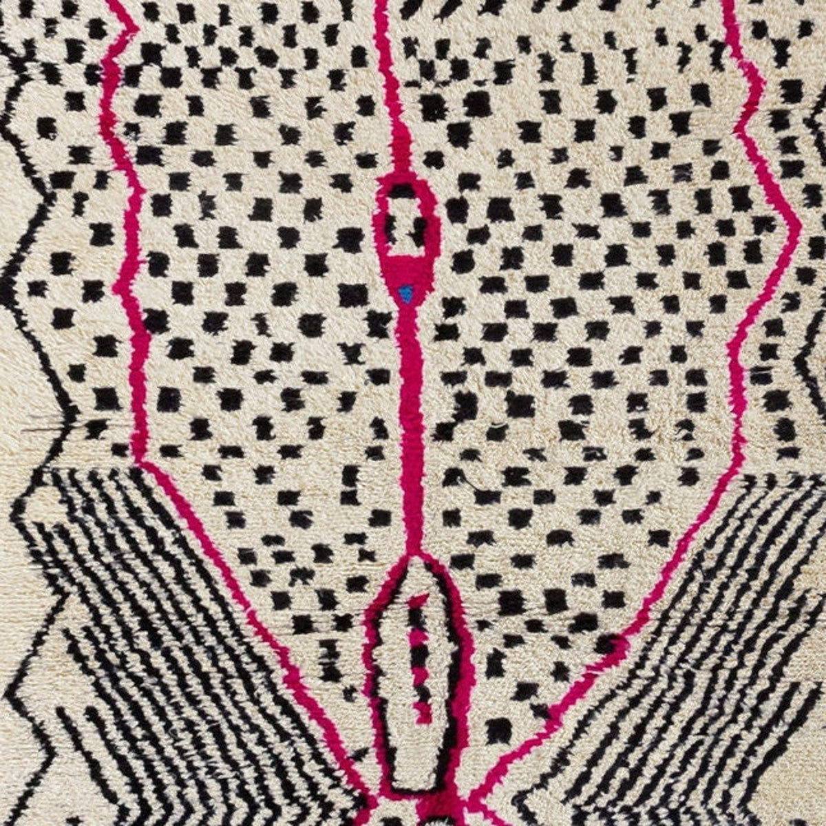 Detail close-up showcasing the geometric design in pink and black on the Azilal rug.