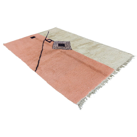 View of the contemporary Berber rug in pink, cream, and black with geometric design.