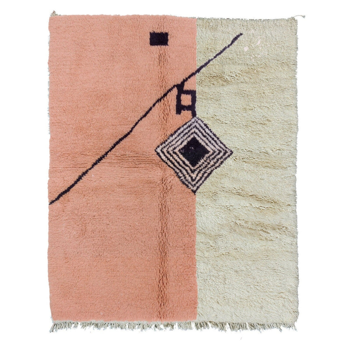 Detail shot of the pink geometric pattern rug with fringe edges.