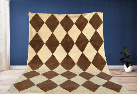 Lifestyle shot of a large brown diamond Moroccan rug in a natural setting.