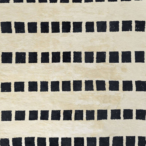 Side view of the black and white striped Moroccan rug showcasing its soft texture.