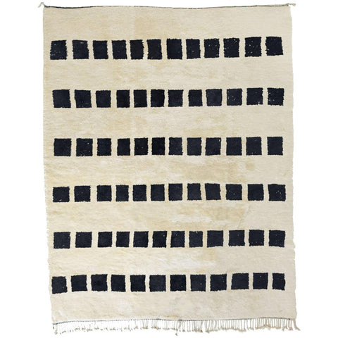 Front view of the black and white striped Moroccan rug with geometric patterns and fringe edges.