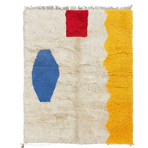 Front view of a multicolor abstract Moroccan rug featuring geometric patterns in beige, red, blue, and yellow.
