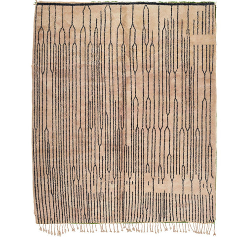Detail close-up of the black and white Moroccan rug showcasing fringe edges and Berber design.