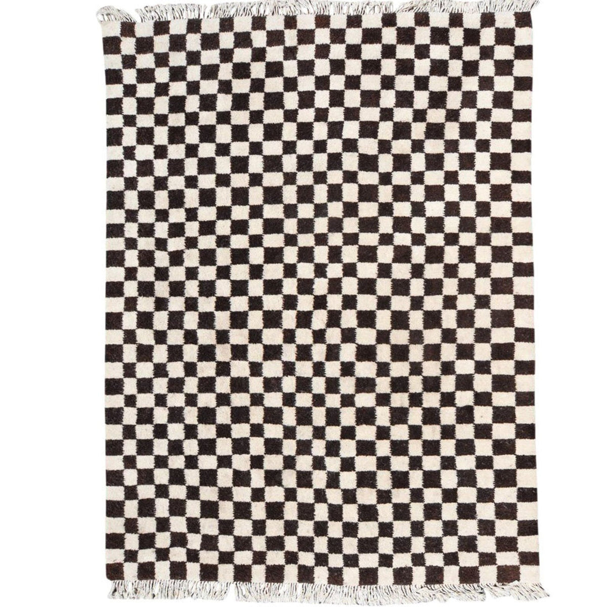 Detail close-up of the black and white checkered pattern on the Moroccan rug.