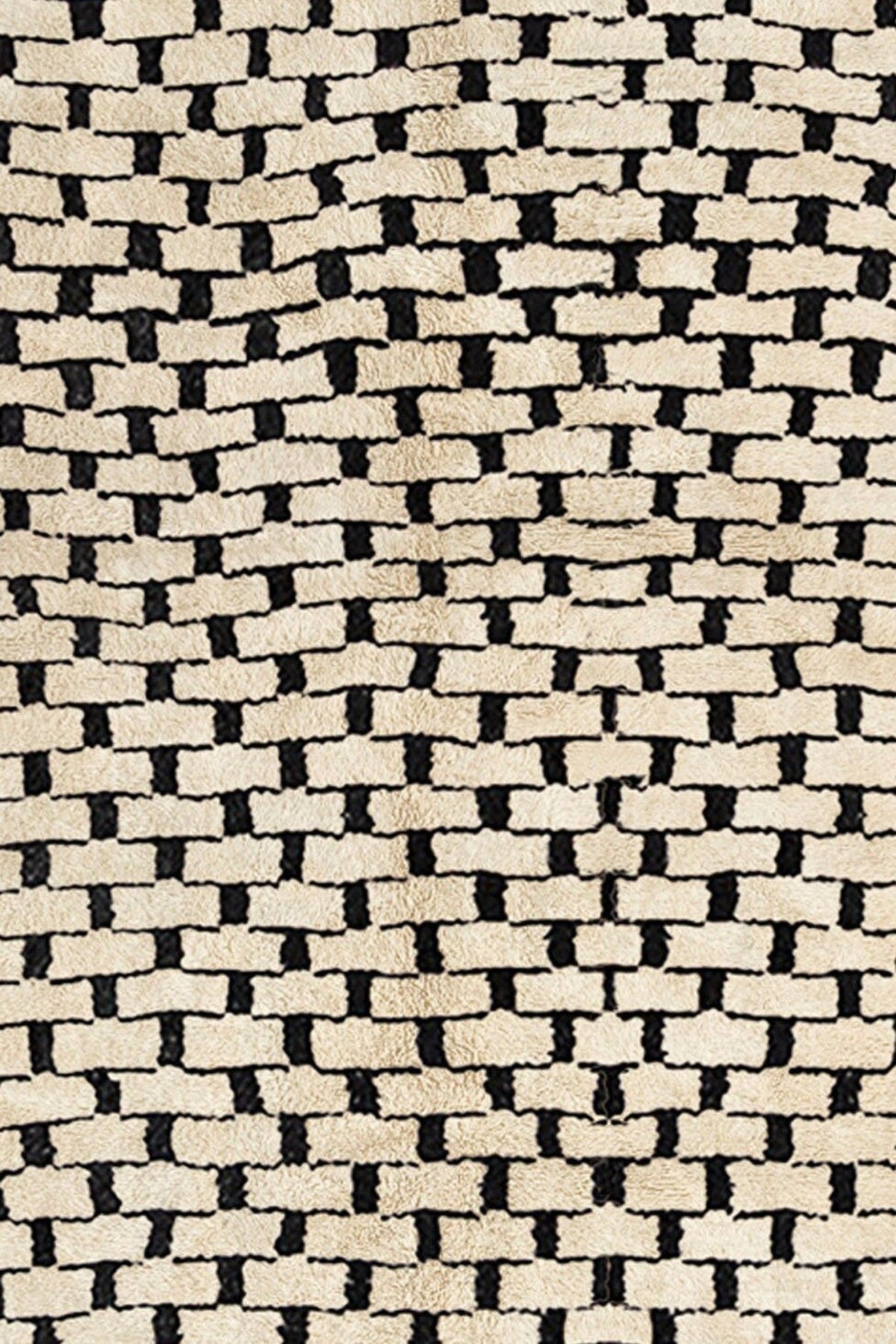 Close-up detail of the soft texture and woven pattern of the gray checkered Beni Ourain Moroccan rug.