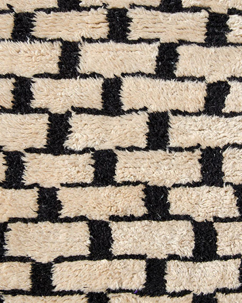 Front view of the gray checkered Beni Ourain Moroccan rug showcasing its abstract design in black and white.
