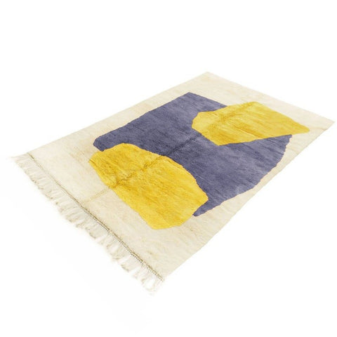 Side view of the mustard abstract Moroccan rug highlighting its geometric patterns in yellow and purple.