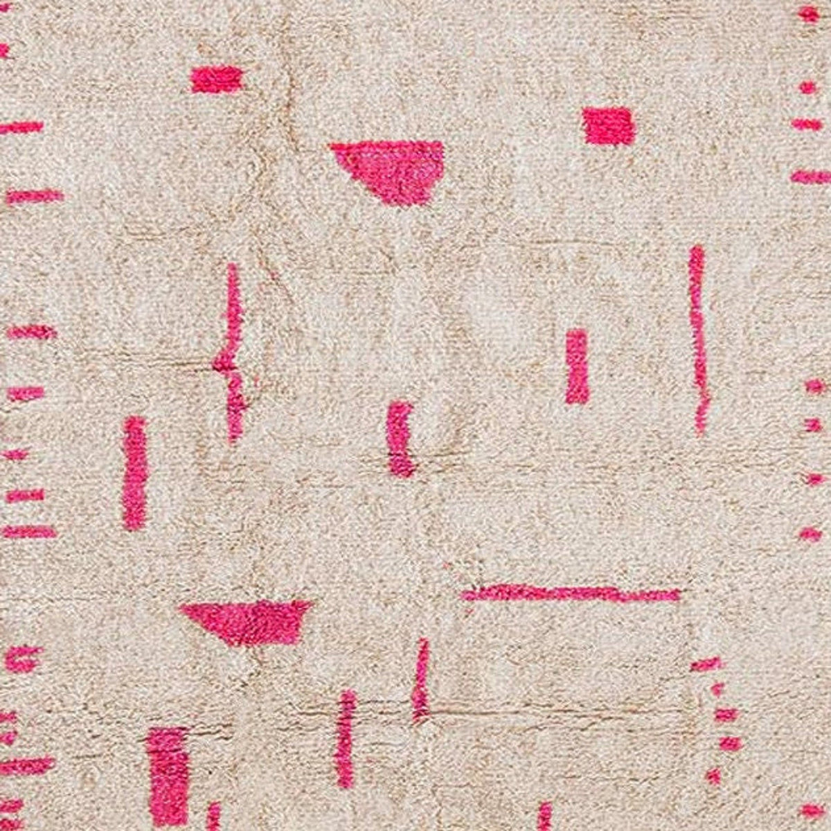 Close-up detail of the textured surface showcasing abstract patterns in pink and beige.