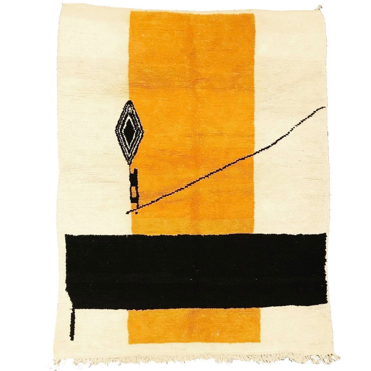 Detail close-up of the orange, cream, and black color block geometric pattern on the rug.