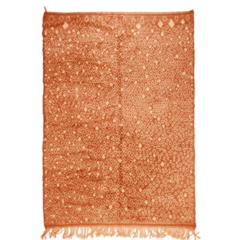 Front view of the orange Moroccan rug featuring an earthy design on a white background.