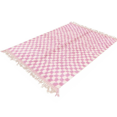 Close-up detail of the pink checkered Beni Ourain Moroccan rug highlighting its abstract pattern.