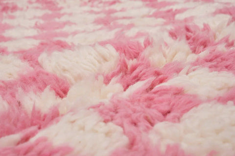 Front view of the pink checkered Beni Ourain rug highlighting its checkered pattern.