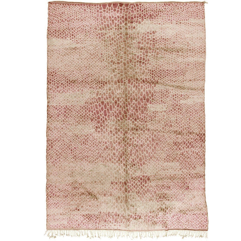 Front view of a dusty rose textured Moroccan rug with an abstract design in pink and rust colors.